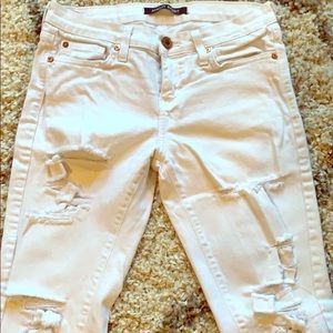 Distressed White skinny jeans